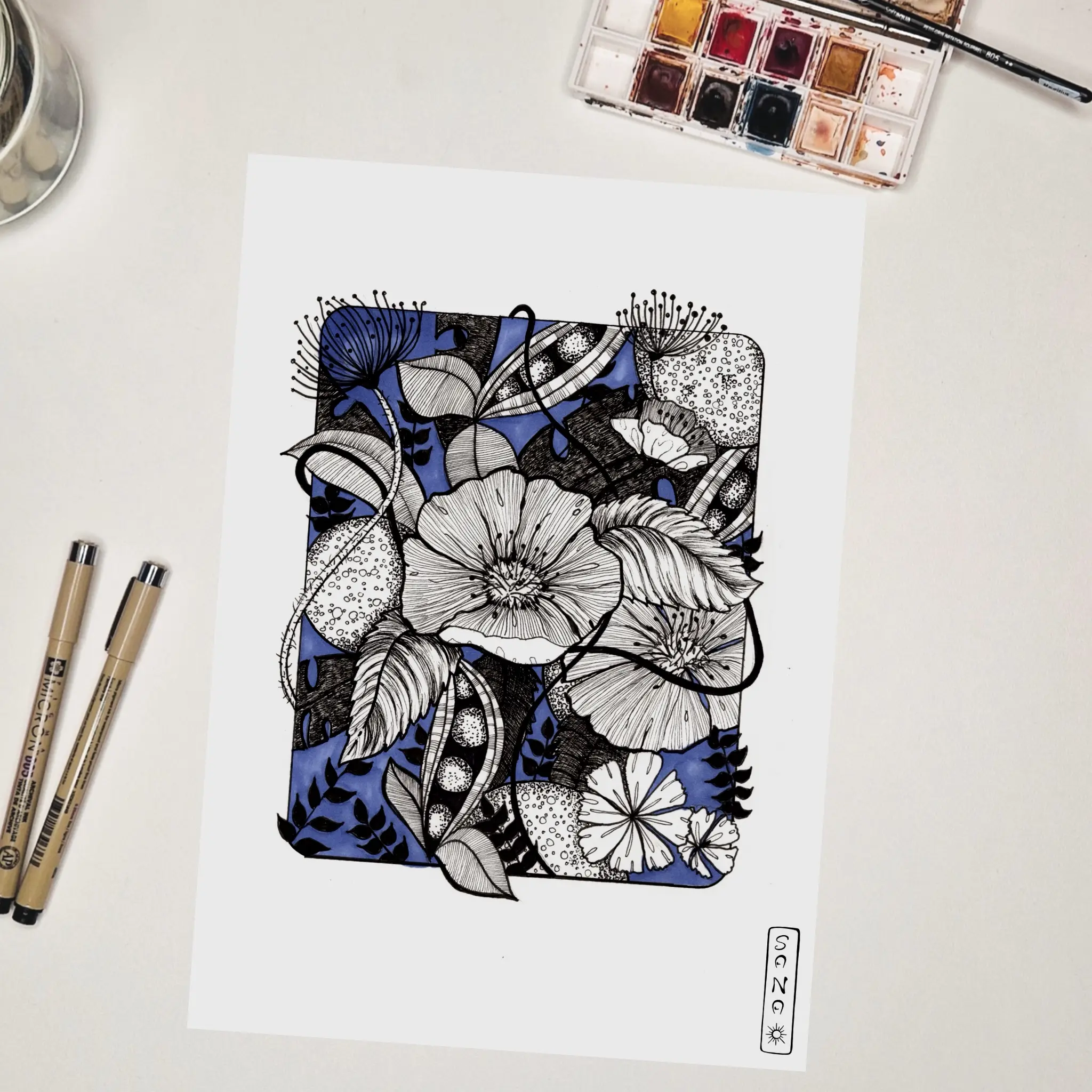 Planche d'illustrations de fleurs sur fond bleu.